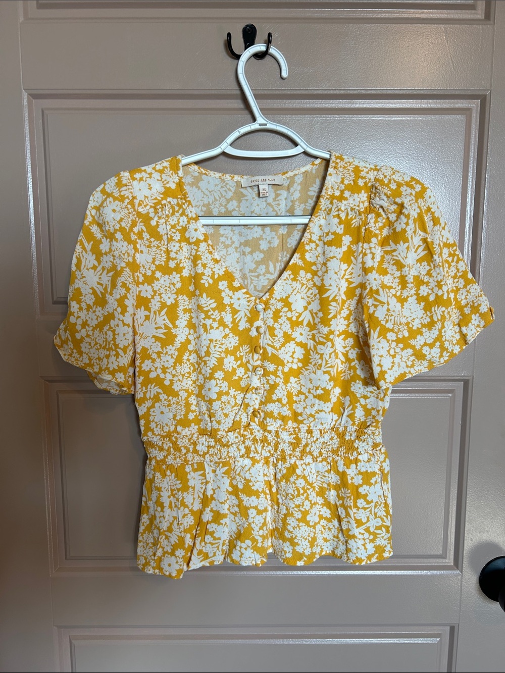 Skies Are Blue Yellow and White Floral V-Neck Smocked Peplum Top